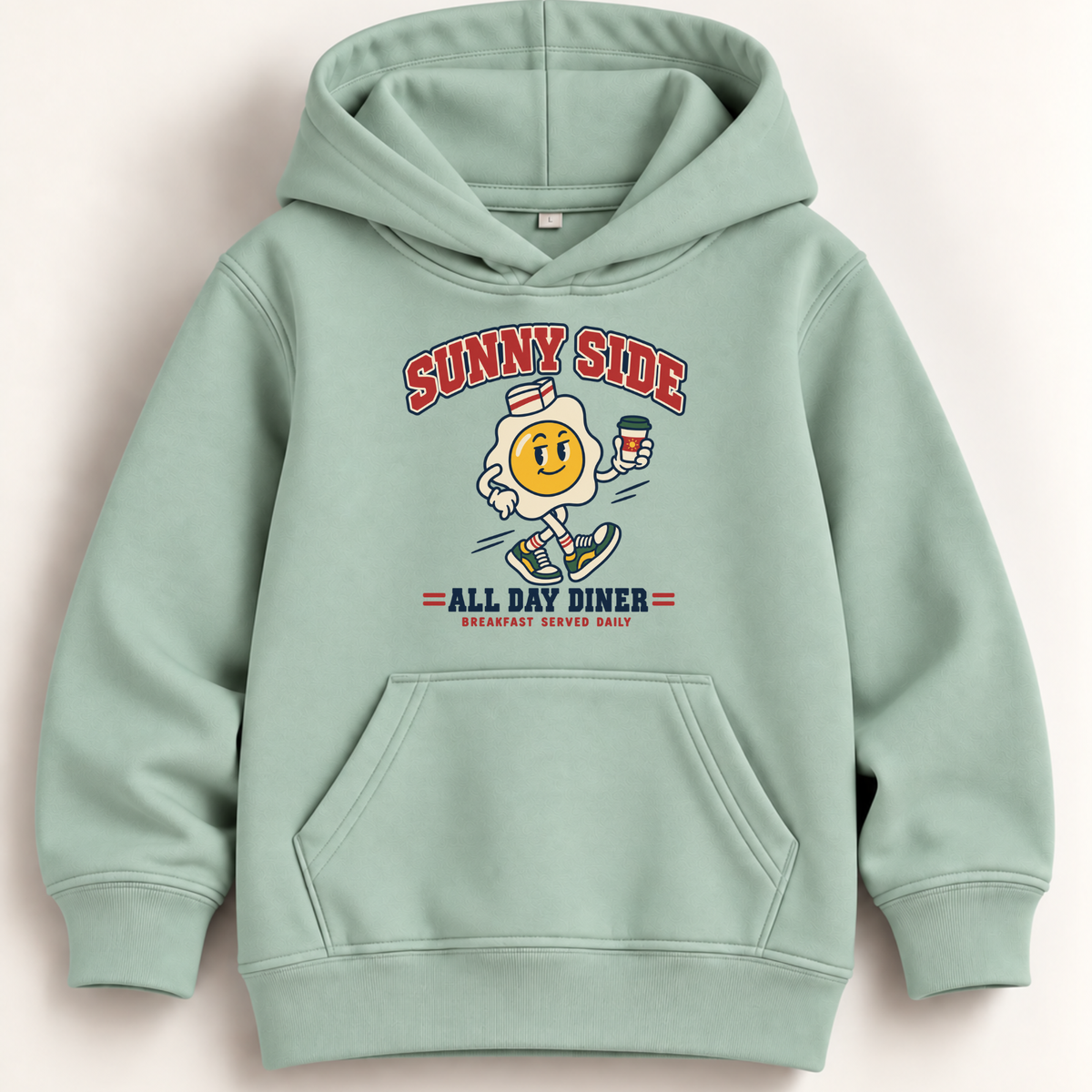 A light mint green pullover hoodie with a retro graphic on the chest. The graphic features the text 'SUNNY SIDE' in red arched letters above a cartoon character resembling a smiling fried egg running with a coffee cup, with 'ALL DAY DINER' and 'BREAKFAST SERVICE DAILY' printed below.