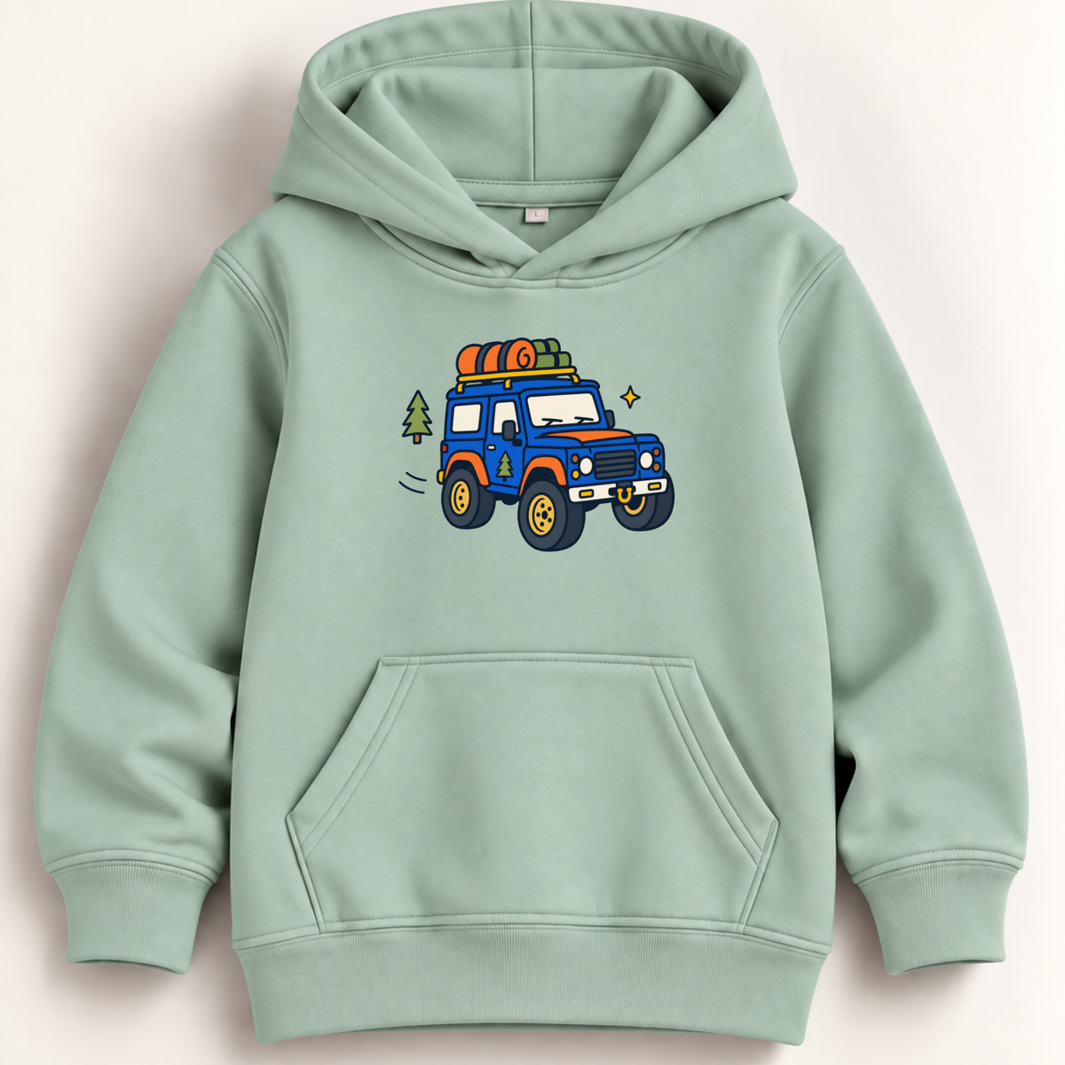 A light sage green kids' pullover hoodie with a colorful cartoon graphic of a blue off-road vehicle carrying camping gear on its roof, displayed against a light beige background.