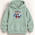 A sage green pullover hoodie with a front kangaroo pocket and a circular graphic on the chest featuring a cartoon character in ski gear with the text 'MOUNTAIN OUTDOOR'.