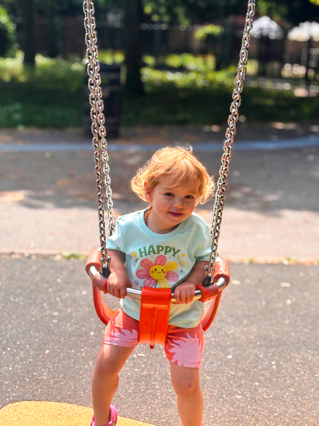 Child on a swing set in a park
