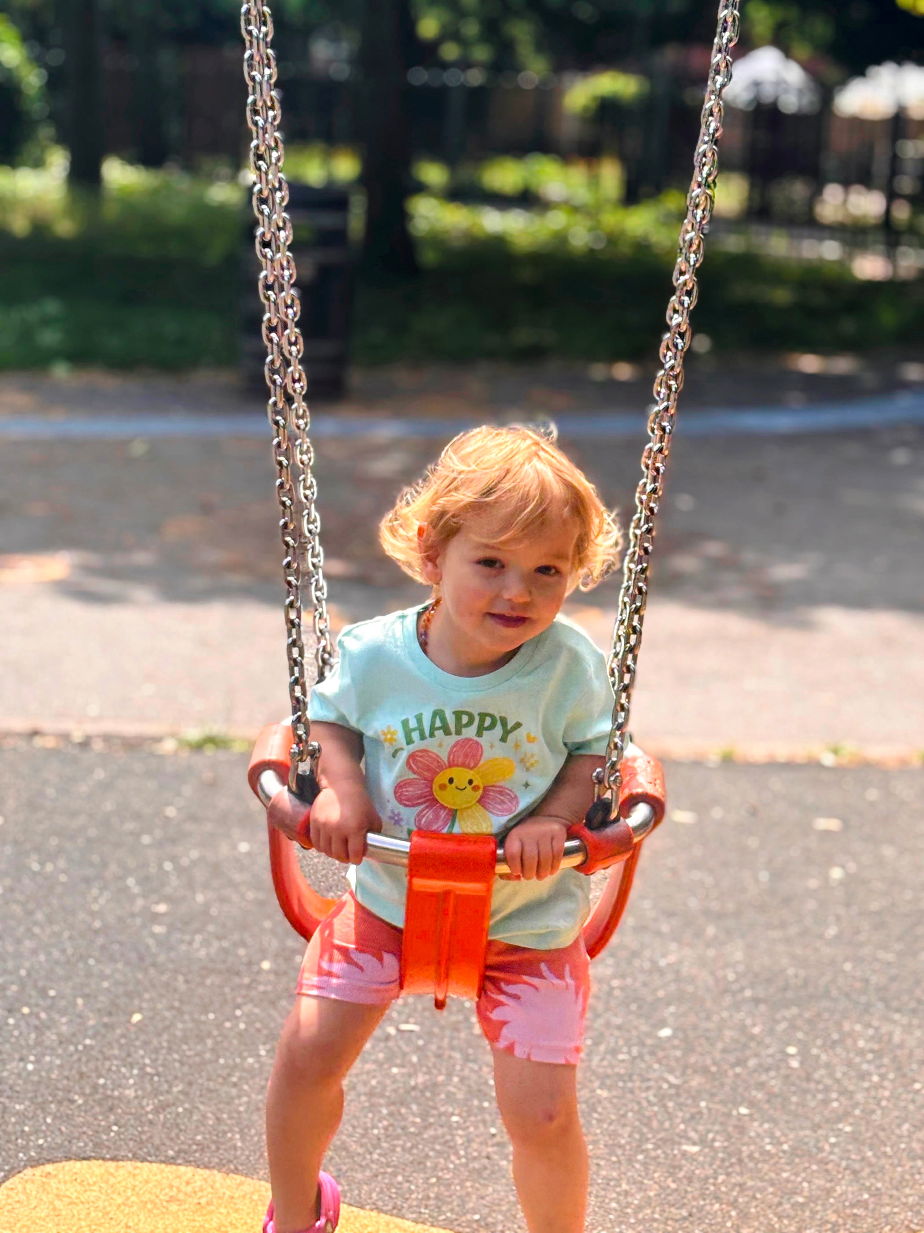 Child on a swing set in a park