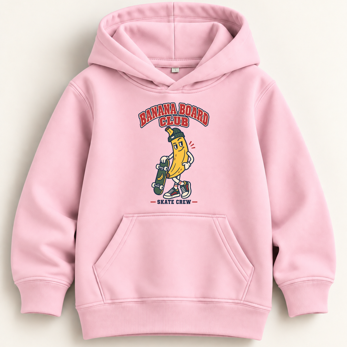 A light pink pullover hoodie with a front kangaroo pocket and a graphic print of a banana character holding a skateboard, with the text 'BANANA BOARD CLUB' and 'SKATE CREW'.