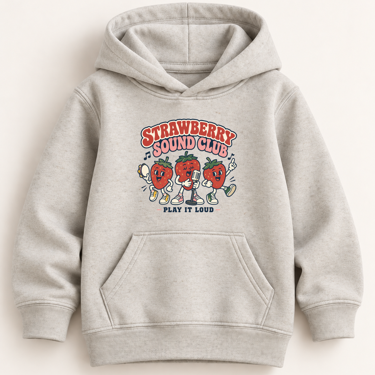A light heather gray pullover hoodie with a colorful graphic on the chest reading 'Strawberry Sound Club' and 'Play It Loud,' featuring cartoon strawberries and a microphone. The hoodie has a front kangaroo pocket and ribbed cuffs and hem, shown against a plain light beige background.