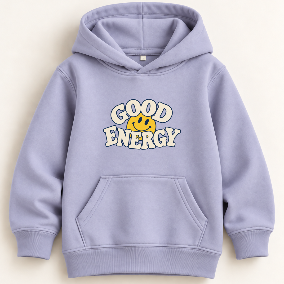 A light lavender-purple kids' pullover hoodie with a front kangaroo pocket and a graphic on the chest that reads 'GOOD ENERGY' in white bubble letters around a yellow smiley face, shown on a warm off-white background.