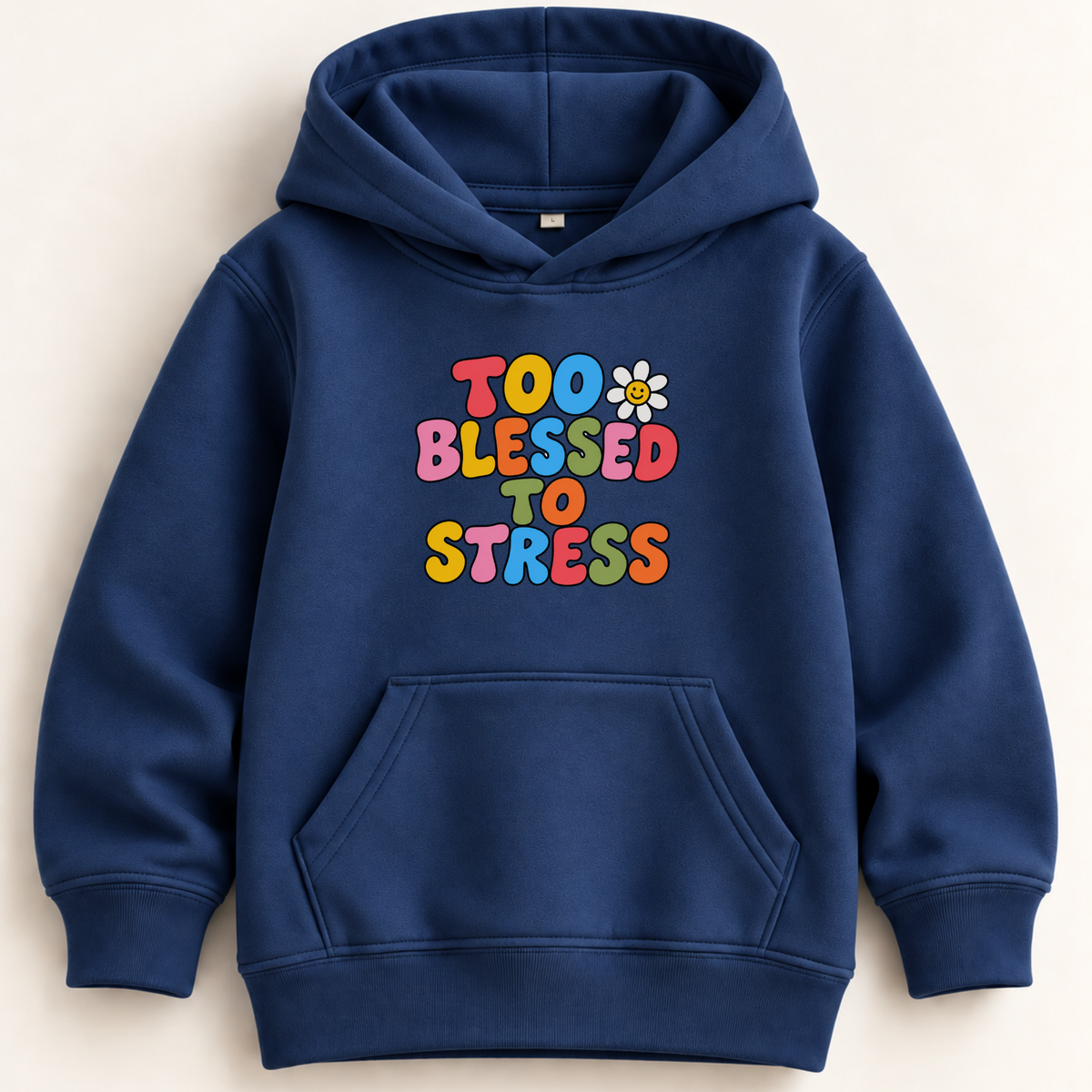 A navy blue pullover hoodie with a colorful retro-style graphic on the chest that reads 'TOO BLESSED TO STRESS' in multicolored bubble letters with a small white daisy. The hoodie is laid flat against a light beige background.