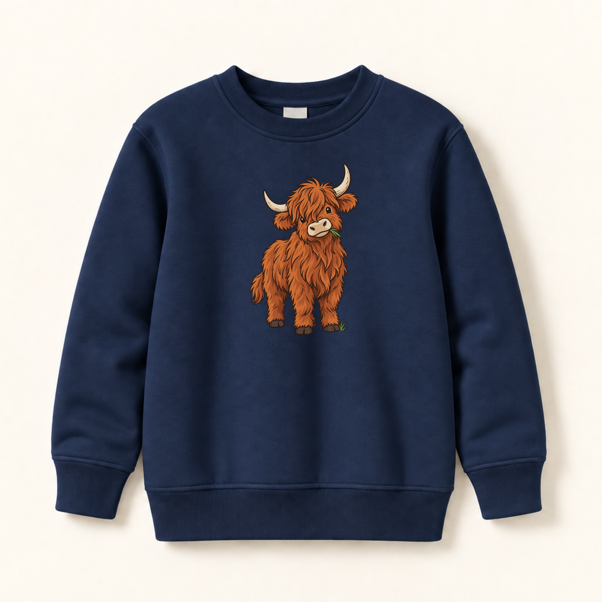 A navy blue crewneck sweatshirt featuring a cartoon illustration of a shaggy Highland cow on the front, displayed against a light cream background.