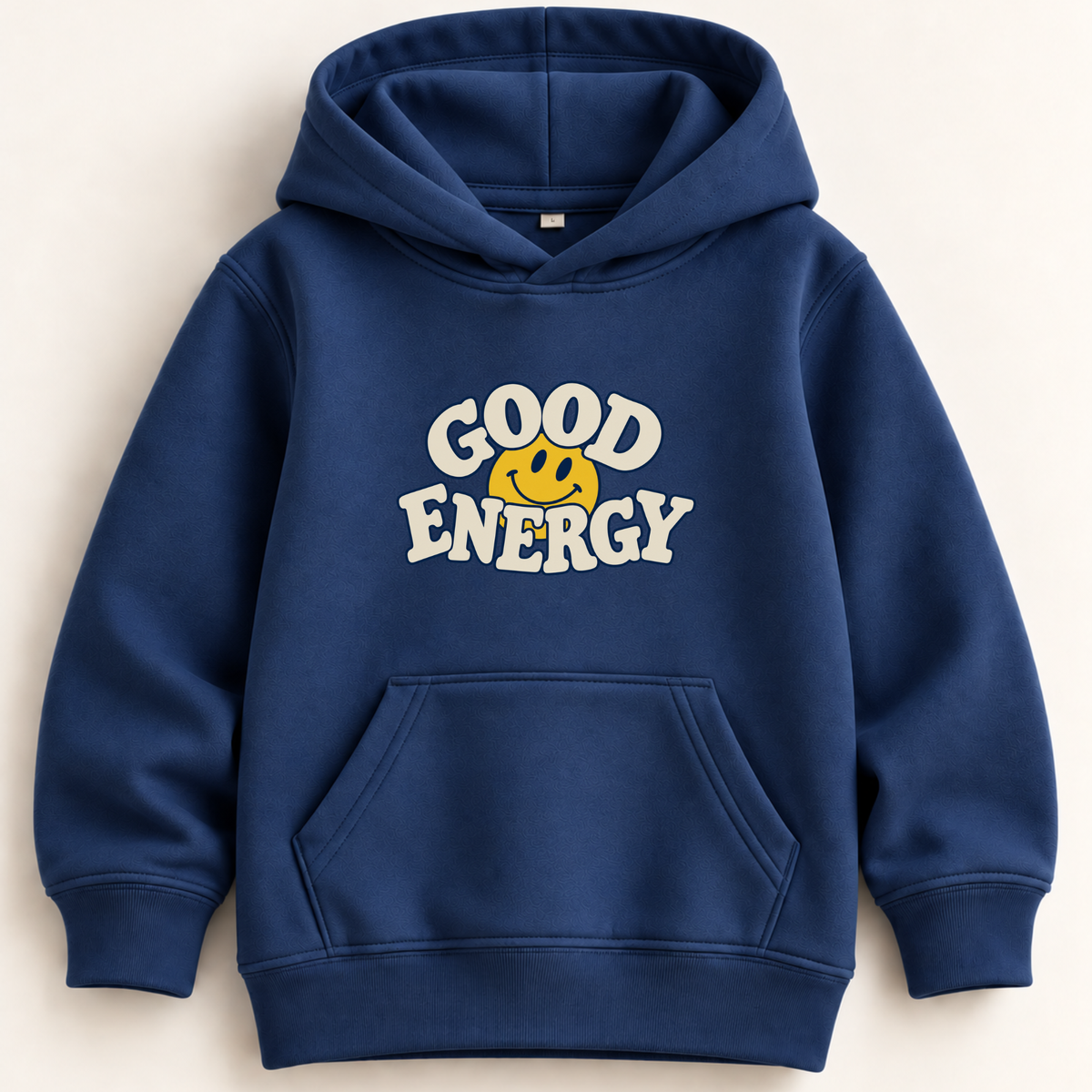 A navy blue pullover hoodie with a front kangaroo pocket and a graphic print on the chest that reads 'GOOD ENERGY' in white letters around a yellow smiley face, shown on a light beige background.