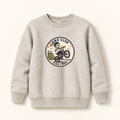 A light heather gray crewneck sweatshirt featuring a circular graphic print on the chest with a cartoon BMX rider and the text 'BMX CLUB' and 'RIDE FREE'.