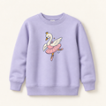 A light lavender crewneck sweatshirt featuring a cartoon graphic of a white swan ballerina with a pink tutu and gold crown, displayed on a warm off-white background.