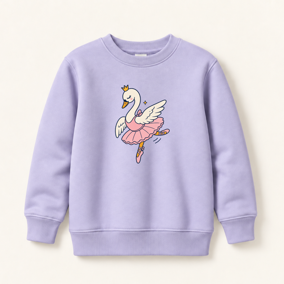 A light lavender crewneck sweatshirt featuring a cartoon graphic of a white swan ballerina with a pink tutu and gold crown, displayed on a warm off-white background.