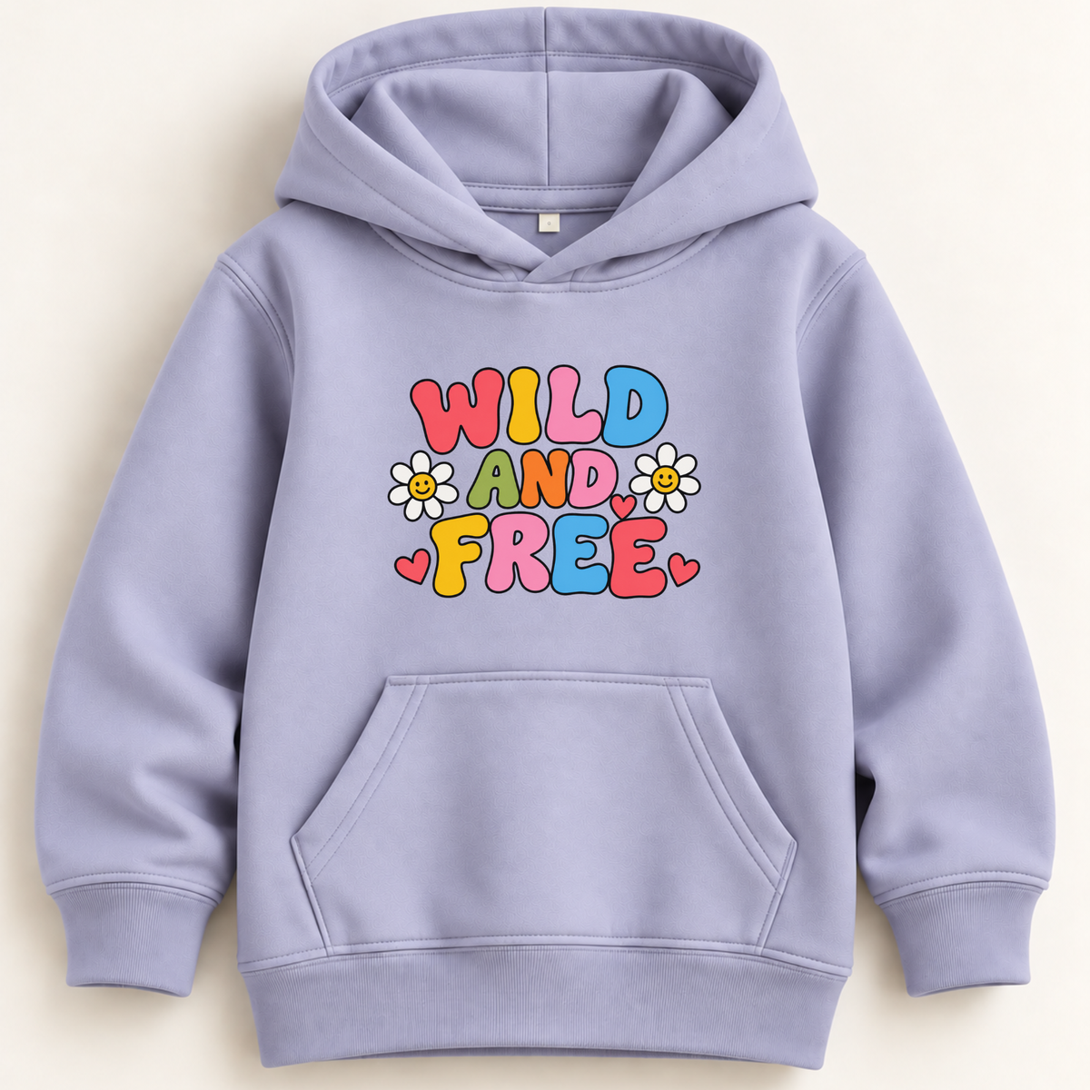 A light lavender-purple kids' pullover hoodie with a colorful retro graphic on the chest that reads 'WILD AND FREE' in multicolored letters, decorated with small white daisies and pink hearts. The hoodie features a front kangaroo pocket and ribbed cuffs and hem, shown against a plain cream background.