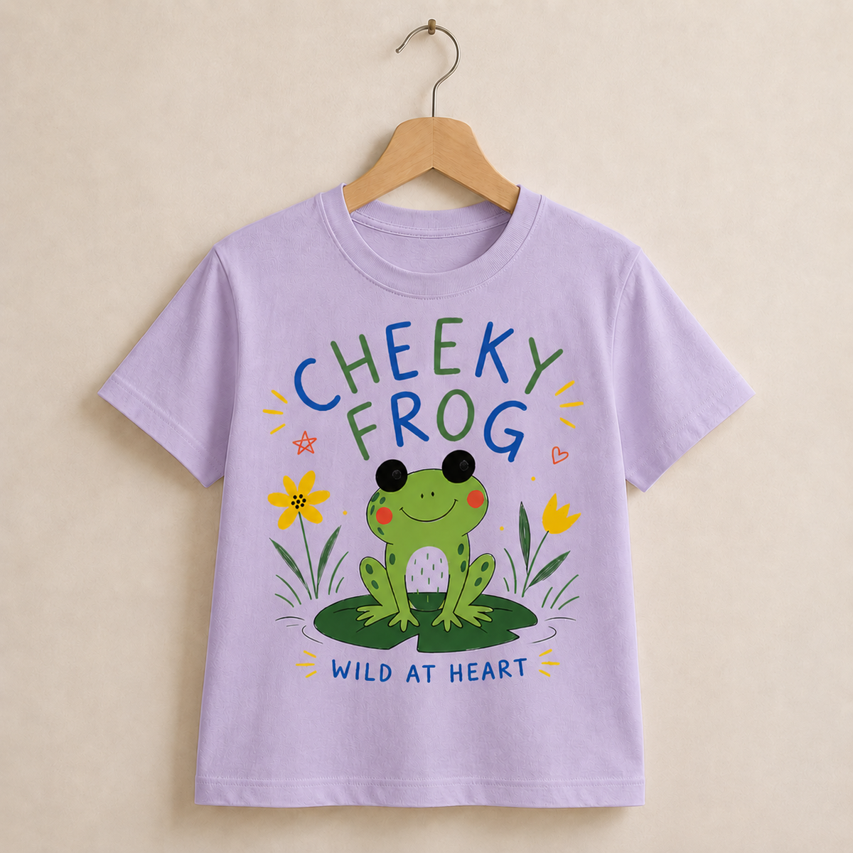 Purple t-shirt with a frog graphic and text on a beige background